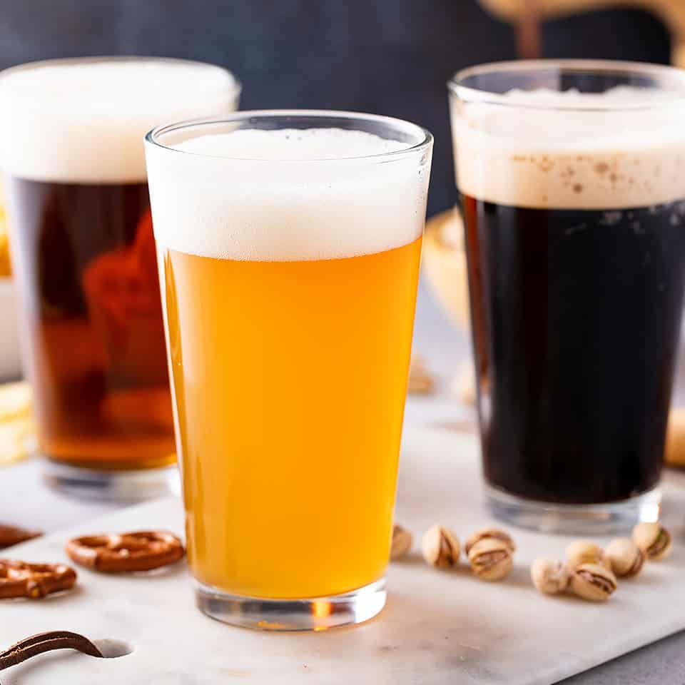 Variety of beer and snacks on table